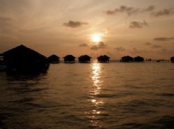 Sunrise at Sipadan Water Village, Mabul Island by Alex Lim 